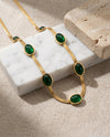 Gold Tone Flat Woven Chain Necklace with Oval Green Cabochon Stones