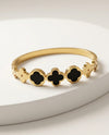 Gold Tone Clover Bangle Bracelet with Black Inlays