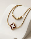 Gold Tone Double Strand Necklace with Floral Diamond Pendant and Cube Beads