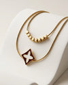 Gold Tone Double Strand Necklace with Floral Diamond Pendant and Cube Beads - Zuni Accessories