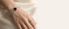 Silver clover tennis bracelet on wrist